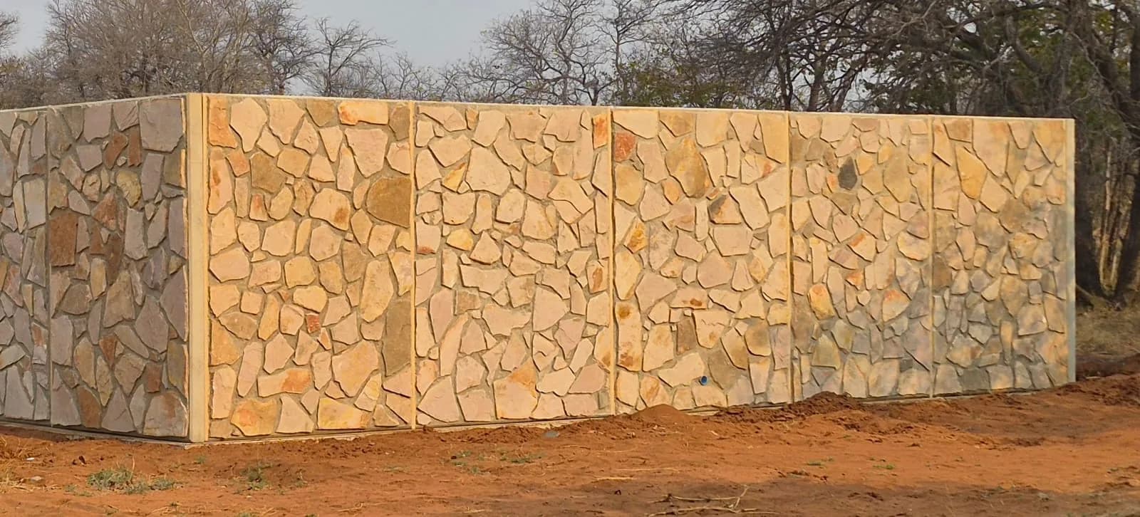 ARTERRA precast walls finished with natural stone cladding on the outside